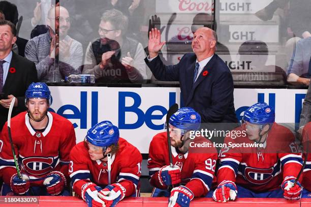 Montreal Canadiens head coach Claude Julien salutes the crowd after the announment of his 1200th coaching game in the NHL during the Boston Bruins...