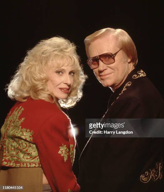 Singer Tammy Wynette; George Jones poses for a portrait in 1995 in Los Angeles, California.