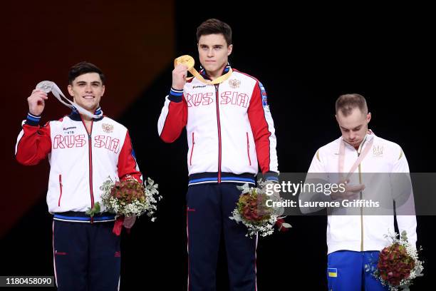 Silver medalist Artur Dalaloyan of Russia, gold medalist Nikita Nagornyy of Russia and bronze medalist Oleg Verniaiev of Ukraine pose with their...