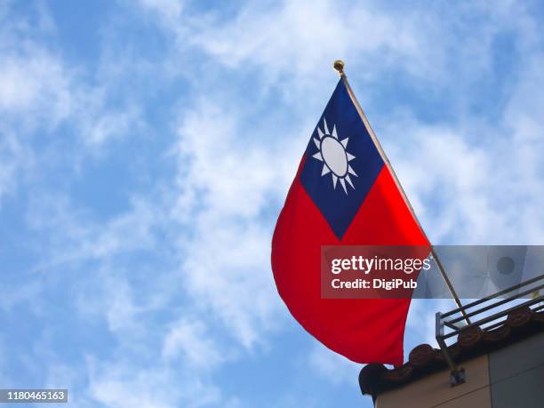 roc flag against sky in the morning on the day of double tenth festival - taiwan flag stock pictures, royalty-free photos & images