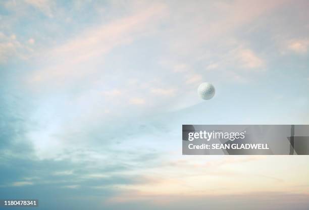 golf ball in sky - golf balls stock pictures, royalty-free photos & images