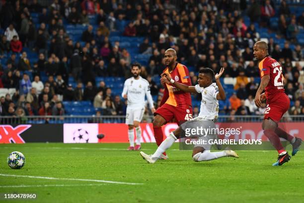 Real Madrid's Brazilian forward Rodrygo scores during the UEFA Champions League Group A football match between Real Madrid and Galatasaray at the...