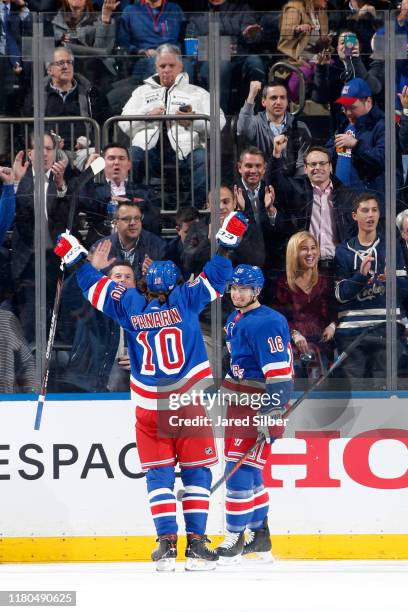 Ryan Strome and Artemi Panarin of the New York Rangers react after scoring a goal in the second period against the Detroit Red Wings at Madison...