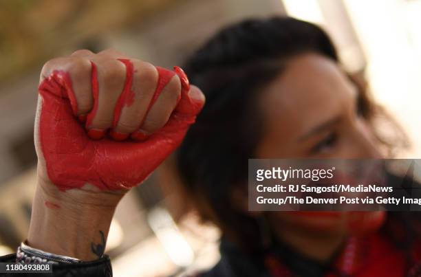 Micaela Iron Shell has painted red hands over their mouth to show solidarity for missing and murdered indigenous, black and migrant women and...