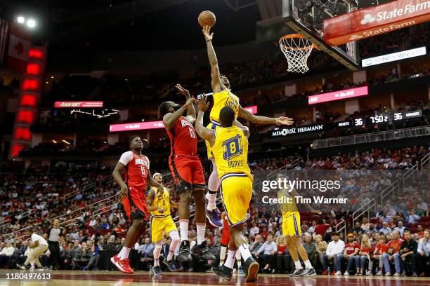 James Harden of the Houston Rockets shoots the ball over Marquese Chriss of the Golden State Warriors in the first half at Toyota Center on November...