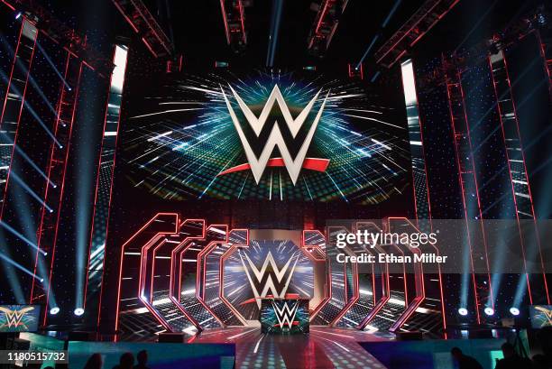 Logos are shown on screens before a WWE news conference at T-Mobile Arena on October 11, 2019 in Las Vegas, Nevada. It was announced that WWE...