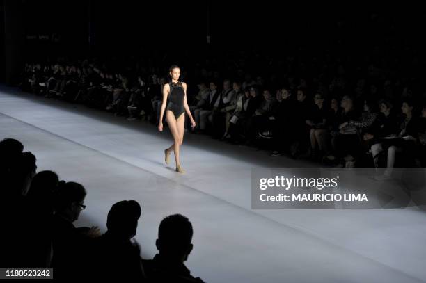 Model presents an outfit by Osklen during the 2010-2011 Spring-Summer collections of the Sao Paulo Fashion Week, in Sao Paulo, Brazil, on June 10,...