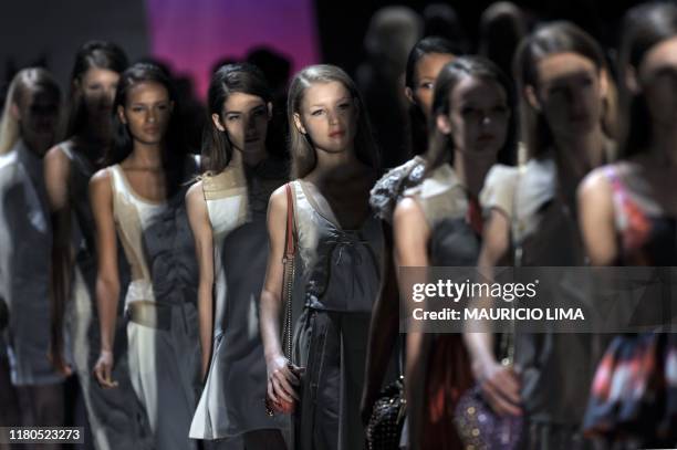 Models parade at the end of the show by Triton during the 2010-2011 Spring-Summer collections of the Sao Paulo Fashion Week, in Sao Paulo, Brazil, on...