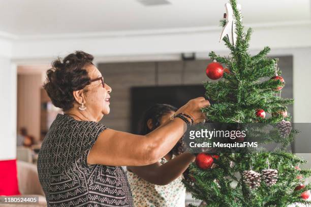 merry christmas indoors - christmas elderly stock pictures, royalty-free photos & images