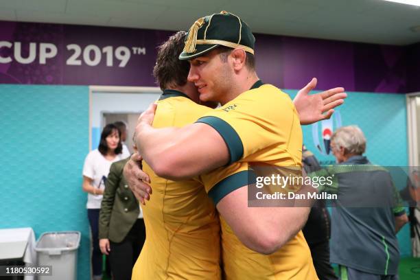 Rob Simmons of Australia is congratulated on his 100th test cap by Izack Rodda of Australia following the Rugby World Cup 2019 Group D match between...