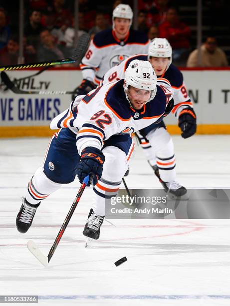 Colby Cave of the Edmonton Oilers plays the puck during the game against the New Jersey Devils on October 10, 2019 at Prudential Center in Newark,...