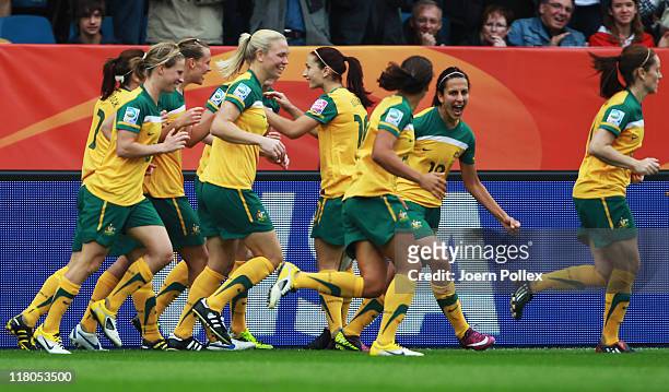 Player of Australia celebrate after Emily van Egmond scored their second goal during the FIFA Women's World Cup 2011 Group D match between Australia...