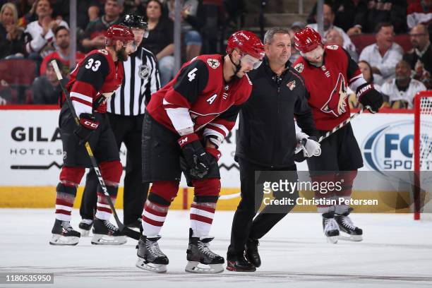Niklas Hjalmarsson of the Arizona Coyotes is helped off the ice during the third period of the NHL game against the Vegas Golden Knights at Gila...