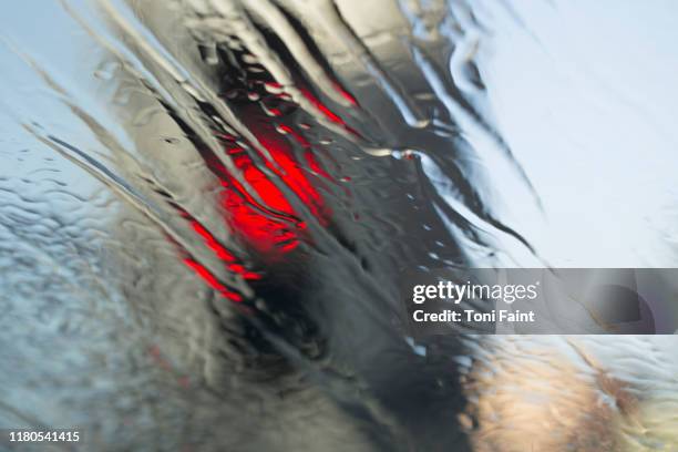 a car going through a car wash to be cleaned - drive through car wash stock pictures, royalty-free photos & images