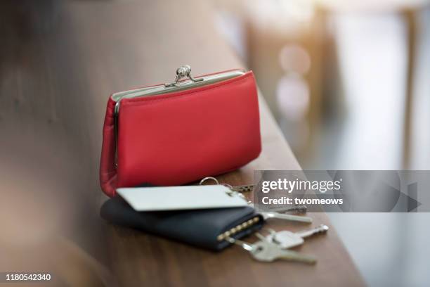 daily objects women's purse, keys in pouch and security access cards. - bolso fotografías e imágenes de stock