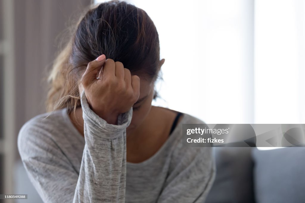 Depressed upset woman feeling hurt sad stressed troubled with problem