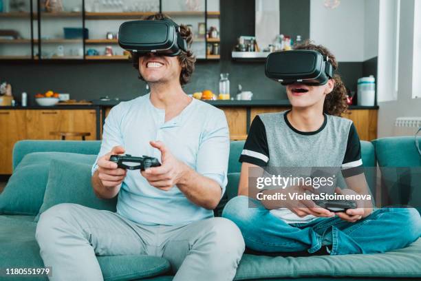 father and son playing with vr - watching parents fight stock pictures, royalty-free photos & images
