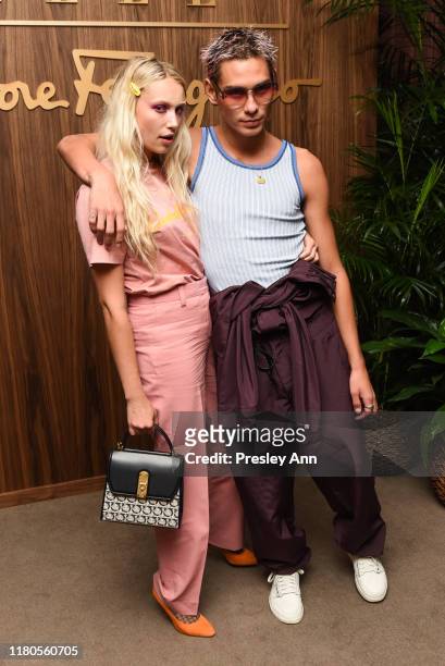 Guest and Evan Mock attend ELLE x Ferragamo Hollywood Rising Party at Sunset Tower on October 11, 2019 in Los Angeles, California.