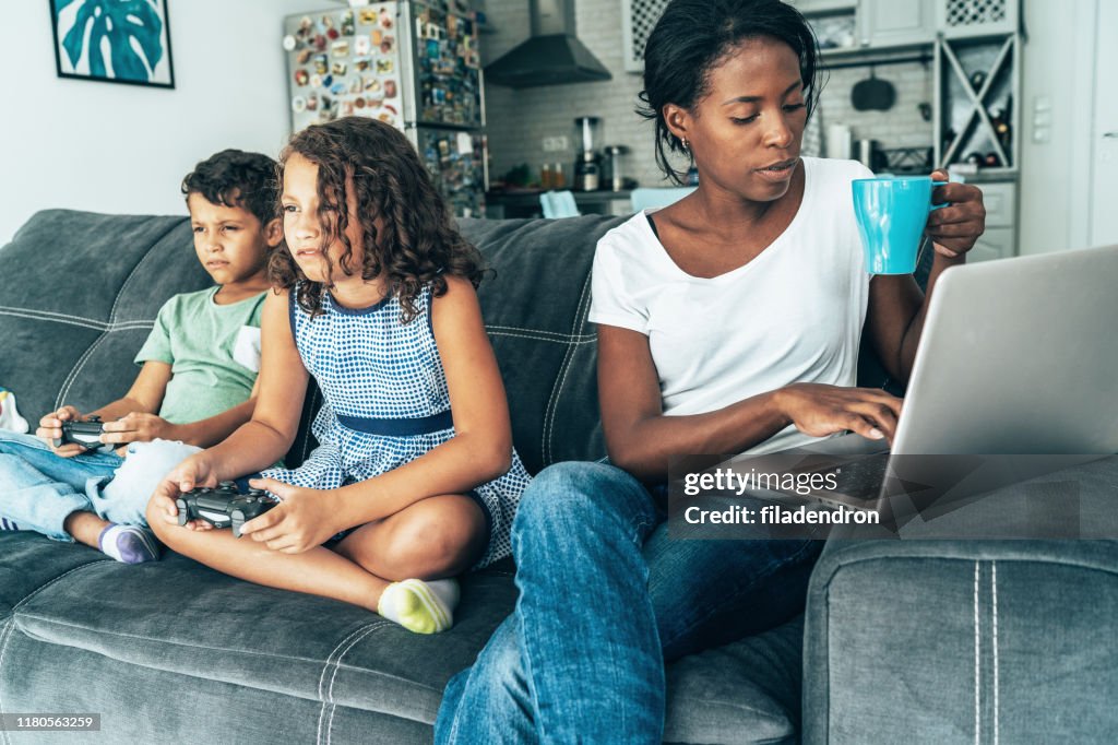 Mixed race family with digital devices