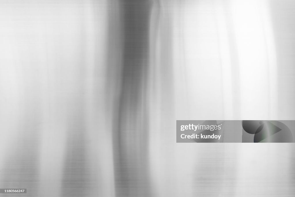 Abstract background from shiny aluminium plate surface.