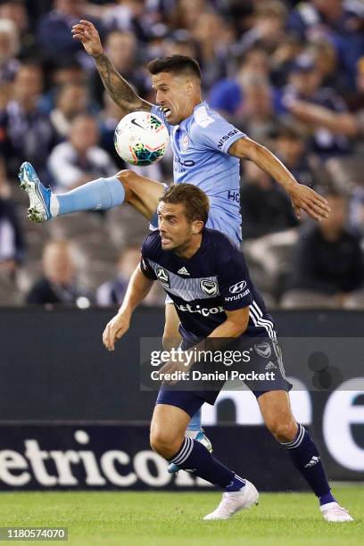 Marcelo Cabrera of Melbourne City and Jakob Poulsen of the Victory contest the ball during the round one A-League match between the Melbourne Victory...