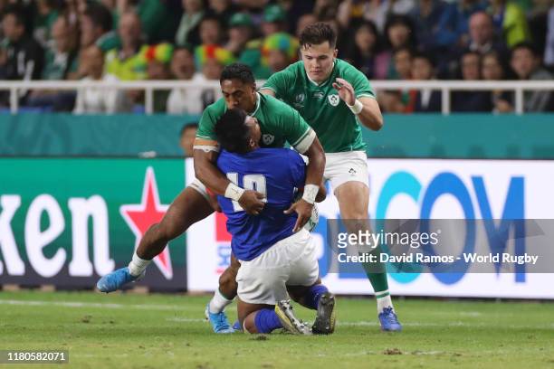 Bundee Aki of Ireland tackles Ulupano Seuteni of Samoa too high which later leads to a red card during the Rugby World Cup 2019 Group A game between...