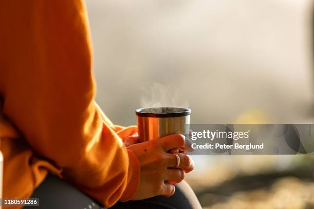 morning coffee outdoors - reusable cup stock pictures, royalty-free photos & images