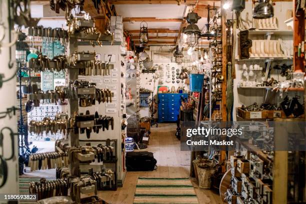 various equipment at illuminated hardware store - loja de ferragens imagens e fotografias de stock
