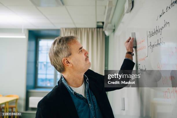 Man Erasing Notes Erasing Whiteboard Photos and Premium High Res Pictures - Getty Images