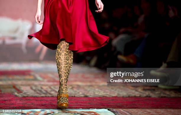 Model presents fashion of the Austrian designer label Lena Hoschek during the Berlin fashion week in Berlin on January 19, 2011. The Berlin Fashion...