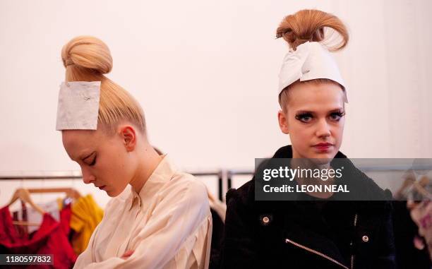 Models prepare to take part in an early walk-through ahead of a presentation by fashion designer Kinder Aggugini for the Autumn/Winter 2011...