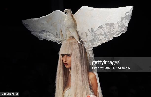 Model shows off a creation by fashion designer Charlie Le Mindu during his Autumn/Winter 2011 collection show, on the third day of the London Fashion...