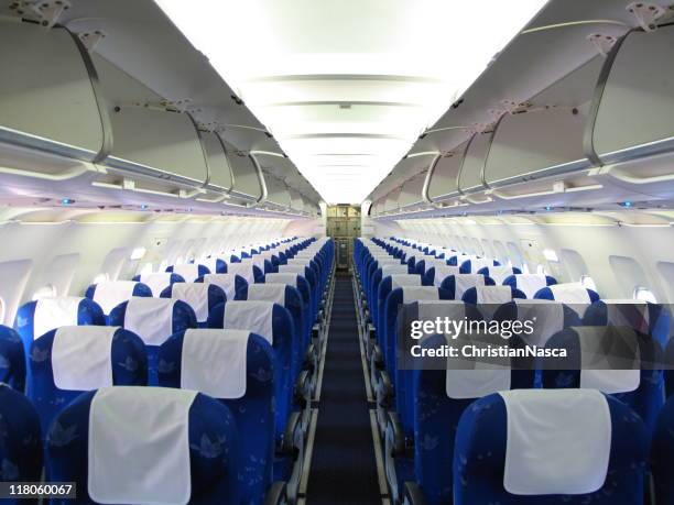 flugzeug innen - aisle seat airline stock-fotos und bilder