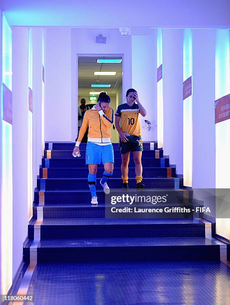 Melissa Barbieri and Servet Uzunlar of Australia walk in the tunnel after the FIFA Women's World Cup 2011 Group D match between Australia and...