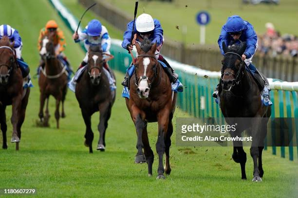 Oisin Murphy riding Military March win The Dubai Autumn Stakes fromAl Suhail and William Buick at Newmarket Racecourse on October 12, 2019 in...