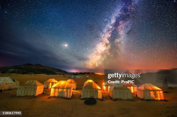 the milky way at the sahara desert  in morocco. - sahara stock pictures, royalty-free photos & images