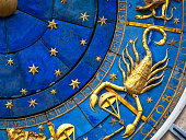 Scorpio astrological sign on ancient clock. Detail of Zodiac wheel with scorpion.