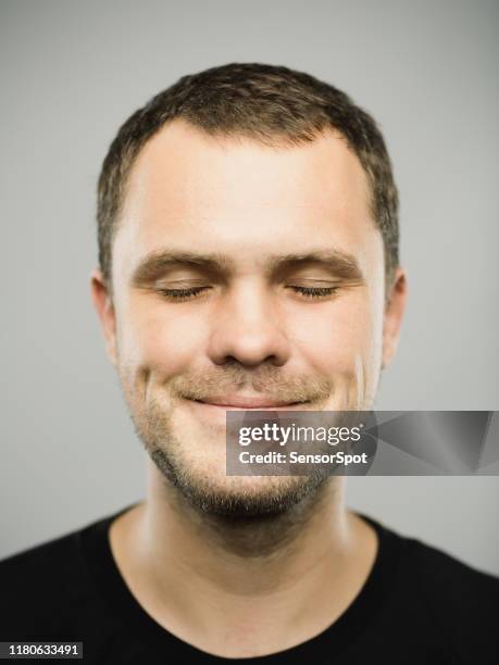 portrait of real caucasian man with happy expression and eyes closed - zen like stock pictures, royalty-free photos & images