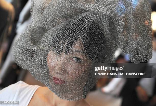 Spectator wears a wire netting during the Mercedes-Benz Fashion Week Berlin Spring/Summer 2012 on July 8, 2011 in Berlin. Shows of the fashion week...