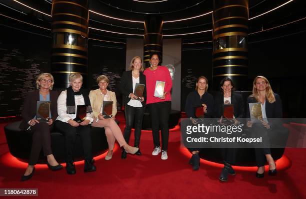 Silvia Neid, Tina Theune, Silke Rottenberg, Renate Lingor, Steffi Jones, Inka Grings, Bettina Wiegmann and Nia Kuenzer poses with their awards...