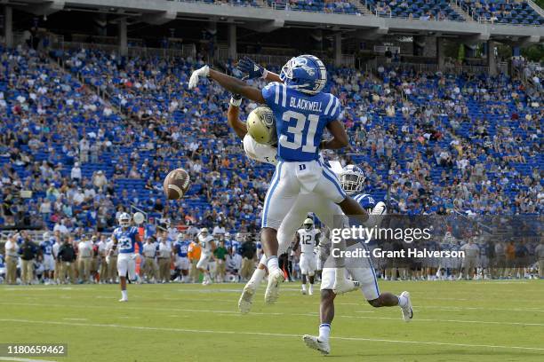 Josh Blackwell of the Duke Blue Devils breaks up a pass intended for Tobias Oliver of the Georgia Tech Yellow Jackets during the second half of their...