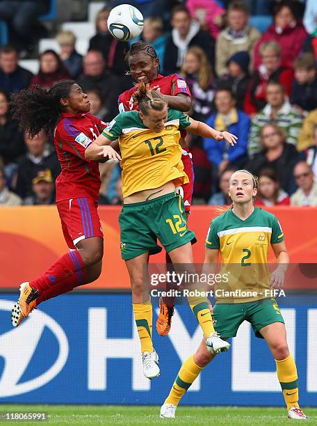 Emily Van Egmond of Australia is challanged by her opponents during the FIFA Women's World Cup 2011 Group D match between Australia and Equatorial...