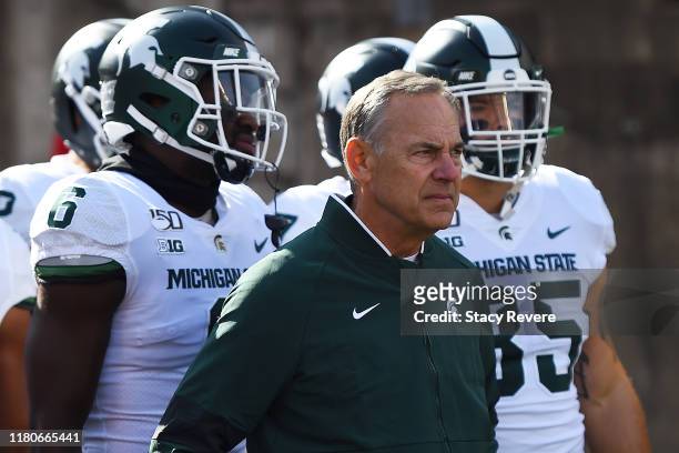 Head coach Mark Dantonio of the Michigan State Spartans takes the field with his team prior to a game against the Wisconsin Badgers at Camp Randall...