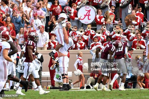 Running back Keilan Robinson and offensive lineman Landon Dickerson of the Alabama Crimson Tide celebrate scoring a touchdown during the game against...