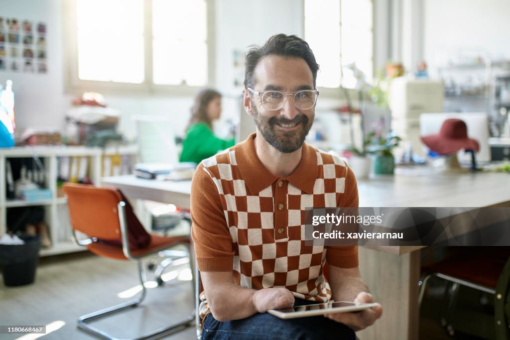 Portrait of Spanish Design Professional Using Digital Tablet