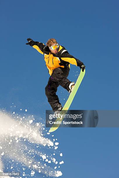 extreme snowboarder jumping in powder snow - snowboard jump bildbanksfoton och bilder