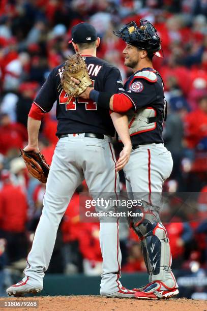Daniel Hudson and catcher Yan Gomes of the Washington Nationals celebrate after the final out to defeat the St. Louis Cardinals 3-1 in game two of...