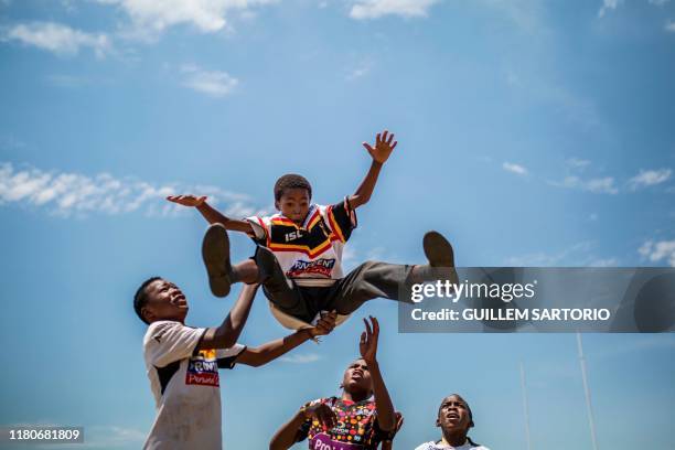 Players from the Soweto Rugby School Academy practice how to do a line out in Soweto, on November 6, 2019. - These players are part of the Soweto...