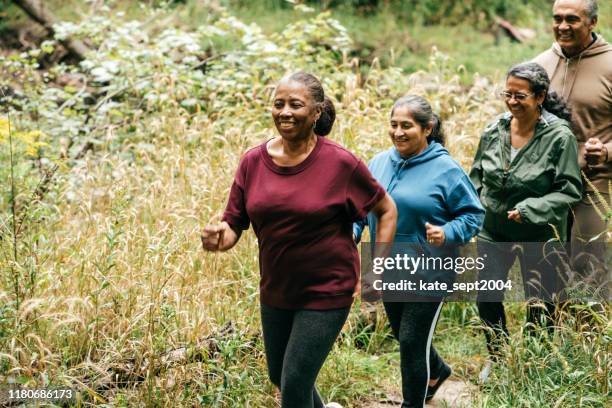 outdoor walks for seniors - active seniors autumn stock pictures, royalty-free photos & images