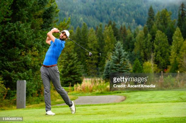 golfer making the drive - golfer stock pictures, royalty-free photos & images